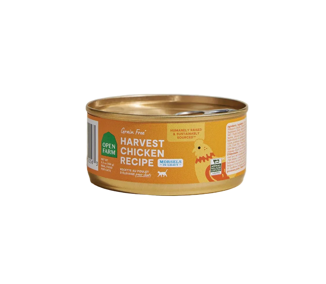 Can of 'Harvest Chicken Recipe' cat food with a gold lid on a beige background