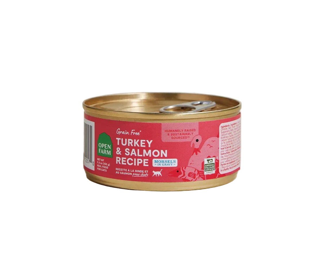 Can of turkey and salmon recipe cat food on a beige background