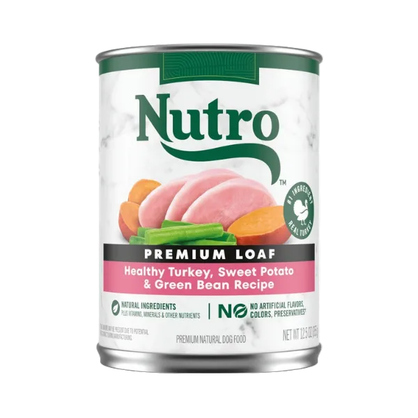 Can of Nutro Premium Loaf dog food with turkey, sweet potato, and green bean ingredients on a white background.